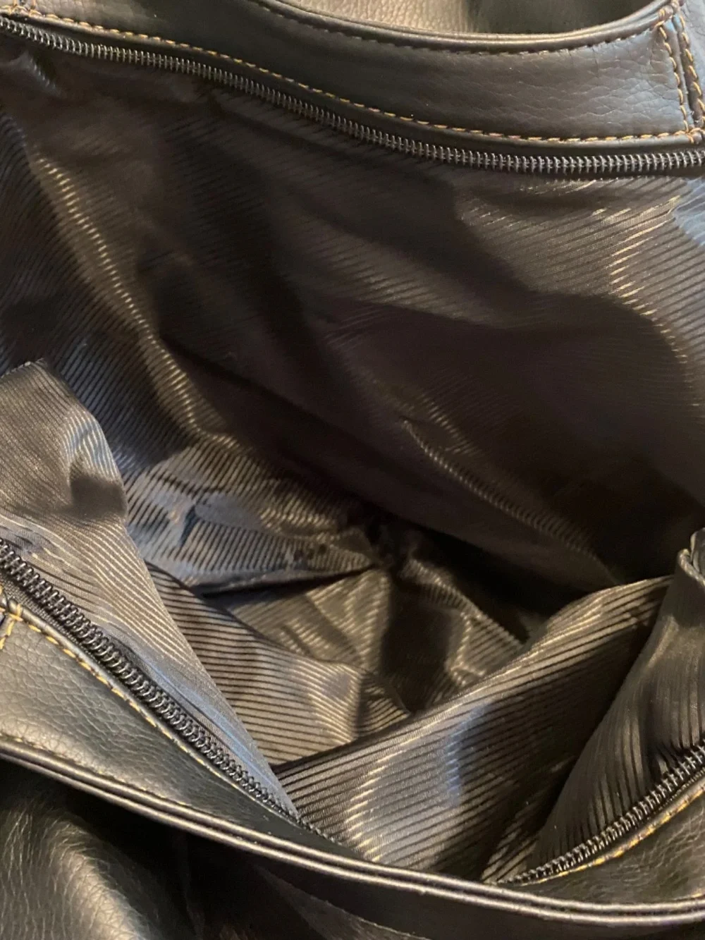 GUCCI black leather hobo handbag. Made in Italy with logo on the front.